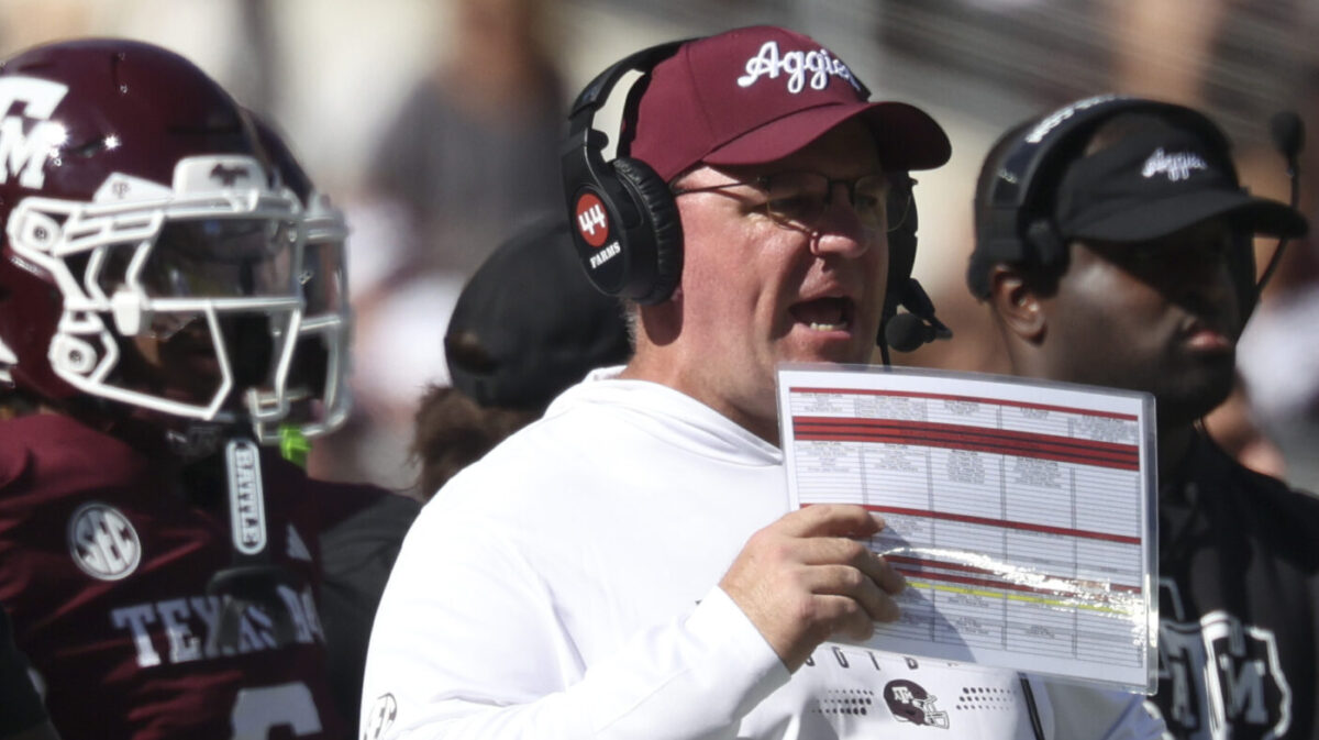 Texas A&M signs head coach Mike Elko to contract extension after he was linked to the Penn State coaching search.