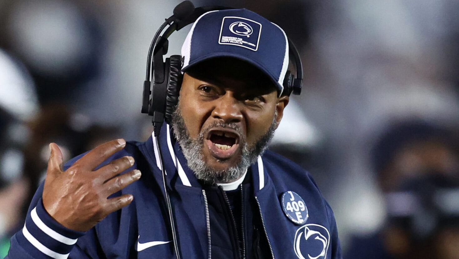 Penn State interim coach Terry Smith on the sideline as debate grows over whether he should be hired as the next head coach.