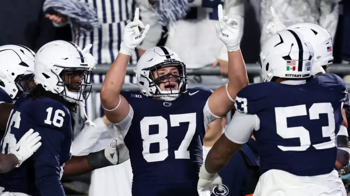 Penn State Football players celebrate during win over Nebraska, the Nittany Lions' second win under interim head coach Terry Smith during a late-season push for bowl eligibility.