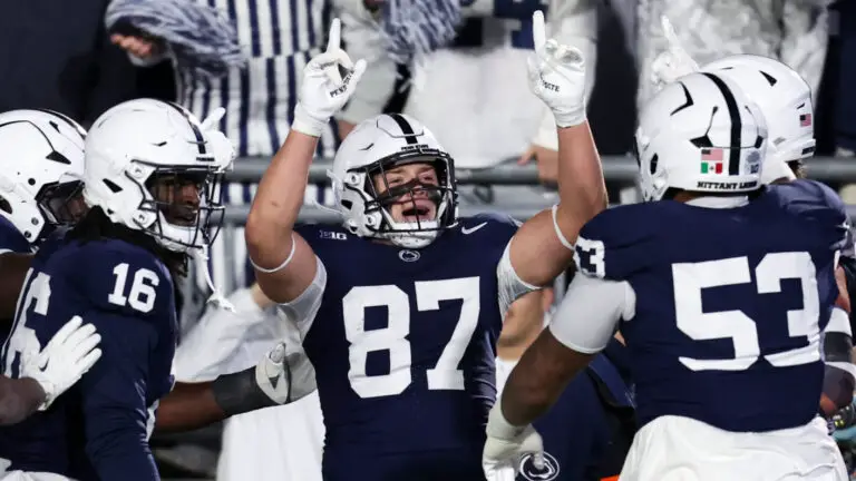 Penn State Football players celebrate during win over Nebraska, the Nittany Lions' second win under interim head coach Terry Smith during a late-season push for bowl eligibility.