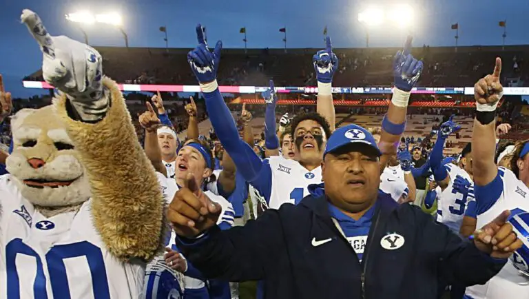 Kalani Sitake, BYU football head coach, intense on the sideline, potentially for the Penn State coaching vacancy.